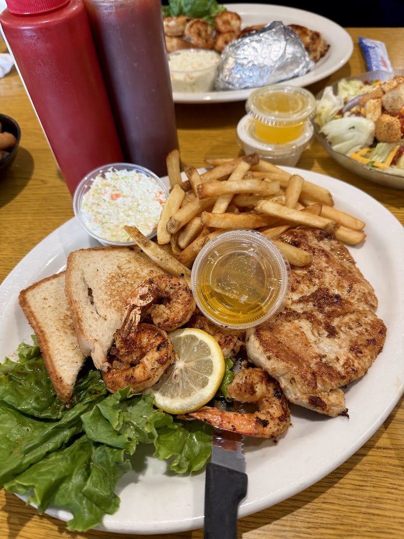 Fried seafood plate with sides on display.